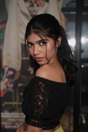  A young woman stands confidently against a movie poster backdrop, her gaze directed straight at the camera, exuding an air of confidence and allure, She wears a black top with a lace pattern, her features softly highlighted by even lighting, Off-center placement draws the viewer's eye towards her, while a subtle hint of a man in the background adds depth to the scene, The movie poster suggests a possible movie theater setting,Sahana15 