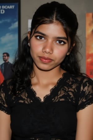  A young woman stands confidently against a movie poster backdrop, her gaze directed straight at the camera, exuding an air of confidence and allure, She wears a black top with a lace pattern, her features softly highlighted by even lighting, Off-center placement draws the viewer's eye towards her, while a subtle hint of a man in the background adds depth to the scene, The movie poster suggests a possible movie theater setting, 