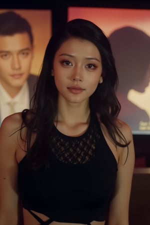  A young woman stands confidently against a movie poster backdrop, her gaze directed straight at the camera, exuding an air of confidence and allure, She wears a black top with a lace pattern, her features softly highlighted by even lighting, Off-center placement draws the viewer's eye towards her, while a subtle hint of a man in the background adds depth to the scene, The movie poster suggests a possible movie theater setting, 