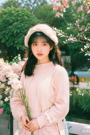 1girl, solo, long hair, looking at viewer, bangs, black hair, long sleeves, upper body, flower, outdoors, day, blunt bangs, mole, blurry, black eyes, sweater, mole under eye, blurry background, white headwear, pink flower, bouquet, bench, photo background, hongkong 80s