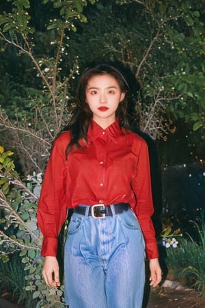 1girl, solo, long hair, looking at viewer, brown hair, shirt, black hair, long sleeves, standing, flower, cowboy shot, parted lips, collared shirt, belt, pants, lips, plant, denim, red shirt, jeans, arms at sides, red lips, shirt tucked in