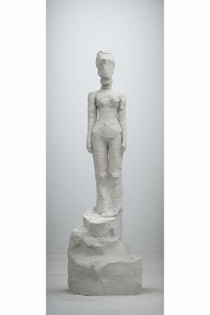 Grey Gypsum sculpture of a woman, eroded surface, rough and raw, full body, old factory background, eroded holes with raw material inside, modern art, photorealistic 
