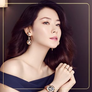 1girl,solo,long hair,looking at viewer,shirt,black hair,bare shoulders,brown eyes,jewelry,upper body,earrings,parted lips,off shoulder,lips,head tilt,watch,realistic,wristwatch
