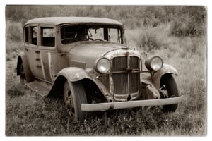 A photo of a rusted car (sepia:0.8)