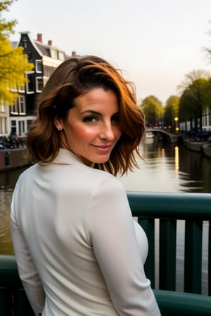 A mature, red-headed woman stands confidently in front of a canal-side backdrop in Amsterdam's charming Holland. She wears a sultry expression, her bright locks cascading down her back as she gazes out at the picturesque cityscape. Soft sunlight illuminates her features, casting a warm glow over the entire scene.