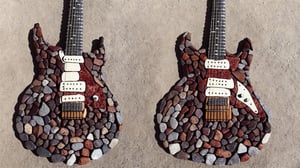 rock_2_img, rock image, rock art, rock, one stone electric guitar shape fully made out of rocks, full view, High detail, rock, best quality, just a shape, not a real guitar you stupid AI