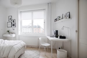 A female student's own room, simple, white walls, window frames, daytime