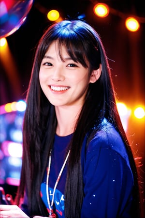 The image is a realistic photograph, not attributed to any specific artist. It depicts a young woman with long, straight hair and bangs, smiling at the camera. She is posed in front of a digital keyboard in a dimly lit, modern studio or possibly a performance space. The background features black curtains and equipment such as speakers, with subtle lighting and reflections creating a cozy atmosphere. Small, colorful string lights add a decorative touch above her head. The overall ambiance suggests a blend of creativity and professionalism.