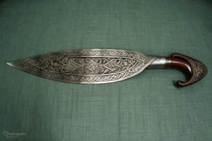 The blade of the barong sword is typically curved and single-edged. It is usually about 2 feet long and 2 inches wide at the widest point. The blade is often sharpened on both sides, but it can also be sharpened on just one side. The blade is made of steel or iron, and it is often decorated with filigree or other designs. The handle of the barong sword is made of wood or ivory. It is often wrapped in leather or cloth. The handle is about 10 inches long and 2 inches wide. It has a grip that is comfortable to hold, and it is often decorated with intricate carvings.