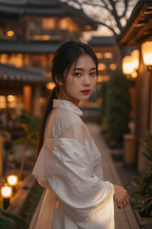 A stunning Asian beauty stands confidently in a serene Japanese garden at dusk. Softly glowing lanterns and a warm sunset hue illuminate her porcelain skin and raven-black hair, styled in a sleek ponytail. Her slender figure is draped in a flowing white kimono, with delicate folds and subtle patterns that catch the light. A gentle smile plays on her lips as she gazes out at the tranquil surroundings.,hunart,Cinematic_Enhancer_Style