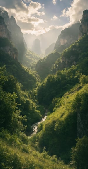 A wide, ultra 4K HD wallpaper showcases a breathtaking, untouched natural landscape. Rolling hills blend into towering, majestic mountains, with a serene river winding through the valley. The foreground is rich with vibrant green foliage, while the background shows mist clinging to the distant peaks. The sky is a dynamic blend of soft clouds and golden sunlight, casting a warm glow across the scene. The beauty of the wilderness is captured in all its untouched splendor, evoking a sense of peace and awe at nature’s magnificence.