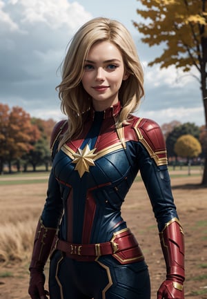 cptmarvel,blonde hair,blue eyes, bodysuit, red gloves, belt, looking at viewer, smiling, 
standing, arms crossed, outside, park, field, autumn, overcast,  extreme detail, masterpiece, lora:cptmarvel-nvwls-v1:.8, cptMarvel
