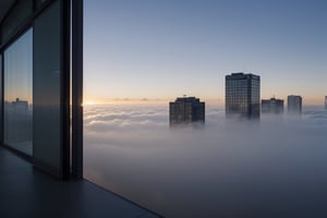 very wide shot,distant screen,eye-level,many buildings under fogs outside window,buttom-up,perspective