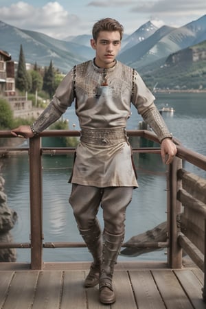 High definition and super realistic photography, A dynamic full body shot of an Extremely handsome 18 year old young man, slim and wiry, fair skin, short hair, big eyes, oval face, He is wearing medieval clothing, thin linen trousers and a light brown Greek-style long shirt, in the background she is on a balcony watching a large lake with mountains in the distance. realistic skin, best quality, intricate detail, high resolution, full shot photography, full body, head to toe photography,