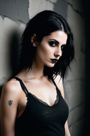 Studio photography: A moody, high-contrast shot of a stunning goth woman posing confidently in front of a distressed concrete wall. She wears a tight-fitting tank top without a bra, her porcelain skin and raven hair drawing attention to her striking features. The analog photograph has a warm, film-like quality, with subtle grain and texture. Her eyes seem to pierce through the darkness as she gazes directly at the camera. The framing is tight, with the subject's body forming a diagonal line that leads the viewer's eye to her enigmatic expression.