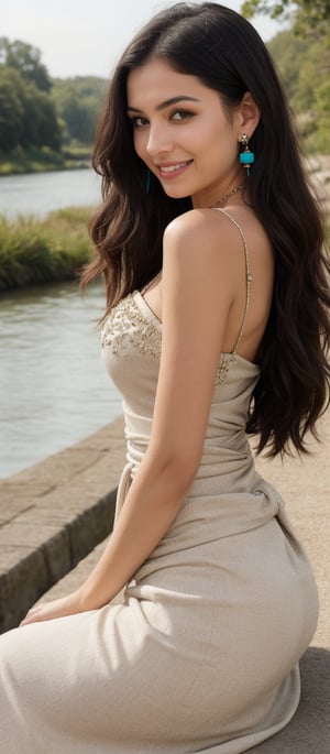 Generate hyper realistic image of a woman with long, flowing black hair that cascades down her back. Her hair is shiny and well-maintained. She has expressive eyes with a friendly and inviting look, enhanced by her natural makeup. She is wearing a beige dress with intricate details and embellishments. The dress has a low-cut neckline adorned with delicate trim and fringe, and it fits snugly around her waist before flowing out. She wears a striking turquoise necklace and matching earrings. She is seated by a serene riverside, her body slightly turned to the side. One hand rests on her knee while the other is gently touching the ground. Her expression is warm and approachable, with a bright smile that lights up her face.