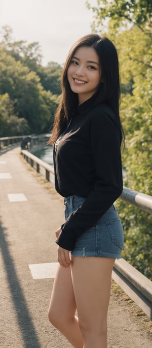 Generate hyper realistic image of a woman with long black hair, standing on a bridge. She wears a black shirt with long sleeves, paired with tight denim shorts and white sneakers. With a smile, she looks directly at the viewer, her hands resting on the bridge railing as if posing for a photo. The sunlight casts a warm glow, adding to the relaxed atmosphere of the moment.