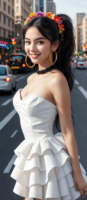 Generate hyper realistic image of a woman with long, black hair styled in voluminous waves. She has a colorful floral headband. Her hair is tied into two high ponytails. She is wearing a strapless white dress with a tiered skirt that gives a flowing and layered effect. The dress has black accents along the neckline and straps, adding a contrast to the bright white fabric. She is adorned with large, colorful hoop earrings and several rings on her fingers. Her expression is innocent, with wide eyes. Her gentle smile adds to her beauty. The background features a bustling city scene with cars and buildings.