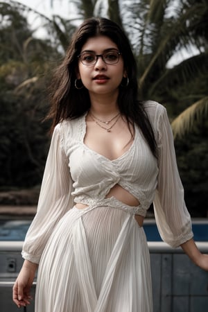 A sultry Mallu girl, 18 years old, with striking twin tails and long hair, gazes directly at the viewer. Her outfit features a modern dress with a heart-shaped cleavage cutout, a full-sleeve shirt, and short trousers. Her upper body is the focal point, with navel exposed. A delicate necklace adorns her neck, complemented by hoop earrings. Red-framed specs add a pop of color to her striking black eyes and luscious lips. The night background sets the tone for this captivating scene, where her dress's heart cutout cleavage takes center stage.