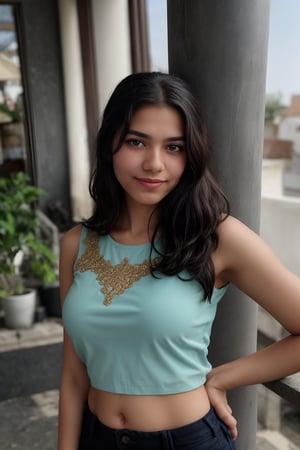 A stunning young woman poses confidently in a bright, sunlit room. She wears an ACMM SS outfit with a striking blue top adorned with intricate designs. The camera frames her from the chest up, highlighting her radiant smile and sparkling eyes. Soft, golden light illuminates her face, while the surrounding space is subtly blurred to emphasize her beauty.