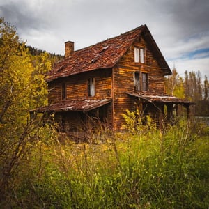 Old rusty house by the lake