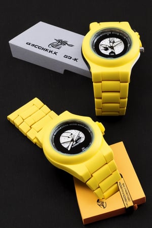 A G-Shock style watch with a black and yellow colorway. The watch is made of durable materials and is water resistant to 200 meters. It has a digital display and a stopwatch function. Displayed on the box, 