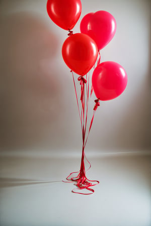 studio photo red balloons, taken on a hasselblad medium format camera
