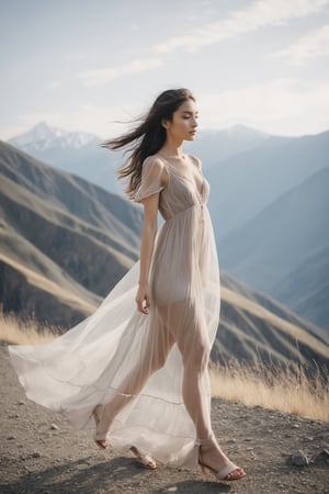 25 years old girl wear babydoll dress thin see through gown walking against the backdrop of mountains, hair flying in the wind, 