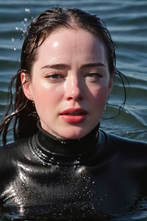 Anna Popplewell, emerging from the water. Her head and shoulders are visible above the surface of water. She looks scared and sad, her black turtleneck top wet and clinging to her, with water droplets sparkling around her. She is gasping for air. She is in the middle of a cold ocean and splashes from her emergence, fully drenched, dripping wet, wet hair, face wet, face drenched