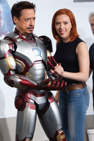 Tony Stark  working with Natasha Romanoff (Scarlet Johansson) testing an Iron Man armour