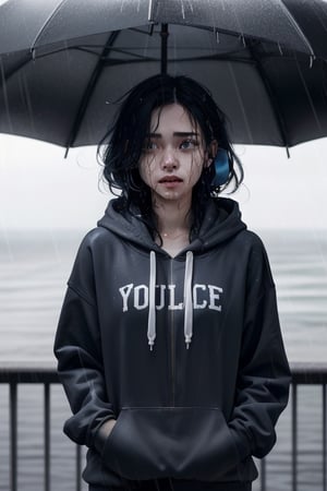 Visualize an exceptionally beautiful girl with long, black and white hair standing at the top of a skyscraper or near the ocean. She's wearing a blue hoodie and has earphones in her ears. Despite her remarkable beauty, she's deeply distressed, tears mixing with the rain as she gazes up at the sky, getting drenched by the pouring rain,Detailedface