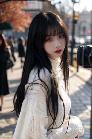 1girl, solo, looking at viewer, bangs, black hair, long sleeves, holding, upper body, outdoors, parted lips, open clothes, day, medium hair, blurry, black eyes, sweater, lips, coat, blurry background, turtleneck, turtleneck sweater, realistic, fence, camera, photo background, holding camera