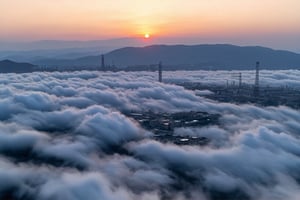 a dense layer of gray clouds illuminated in light rose color from above, a small golden sun, light gray mountains in the distance on the horizon among which power plants and industrial buildings can be seen, closer gray mountains on the horizon among which power plants and industrial buildings can be seen, black mountains on the horizon among which power plants and industrial buildings can be seen,