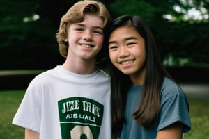 18 year old Irish American boy with brown hair wearing a t shirt, with his best friend who is a 17 year old Asian American girl wearing a dress,