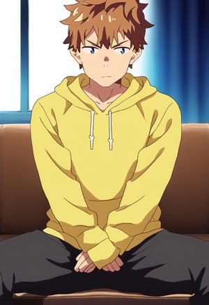 An animated animated image of KINOSHITA KAZUYA sitting on a bench. The man is wearing a green shirt and black pants. His hair is short and brown. His eyes are blue and he has a serious look on his face. His hands are resting on his lap. His arms are crossed over his chest. His head is turned to the right and his mouth is slightly open. He has a yellow hoodie over his shirt. His pants are black and his arms are folded over his left shoulder. He is sitting on a couch, spread legs. The wall behind the man is white and there is a window to the left of the man.