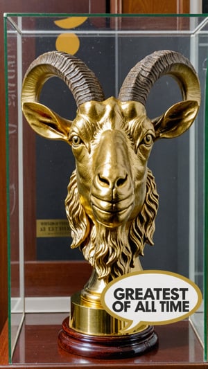 Photo of gold goat head trophy in trophy case with text bubble that says "greatest of all time"