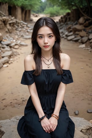 A serene and elegant subject emerges from a rustic setting. Framed by the dark brown cascading hair, the high-angle perspective captures the subject's wide-eyed gaze reflecting a sense of peace. Arms outstretched, adorned with bracelets, contrast against the muddy bank as they sit on the natural terrain. The blurred backdrop of dirt and rocks adds an earthy ambiance, harmonizing with the subject's calm demeanor.