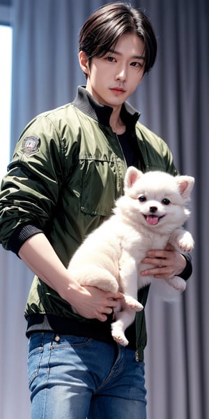 It is a man holding a white-furred Pomeranian puppy and standing with his back on the podium. He is male and has short hair. He is Asian, but his nationality is Korean. His age appears to be mid 40s. He has a good appearance and is wearing a khaki windbreaker and jeans.