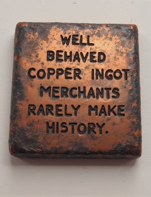 The text "copper ingot merchants" stamped on a square oxidized copper ingot.,Flux Oil art,velvet_myst