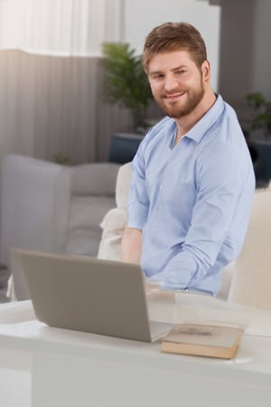 Portrait of a perfectly-shaped realistic man Smiling Handsome Gingerbearded Canadian Man Working from Home on a Laptop Computer in Sunny Cozy Apartment. Successful Male Entrepreneur Does Remote for e-Business Project, uhd, wearing well-rendered fully clothed, rendered in SFM, Cinema 5d, movie still, highres image scan, firm focus, normal life, associated press, Online Shopping, a shutterstock smooth clear clean vibrant image masterpiece,HIGHLY DETAILED,mike zacharias