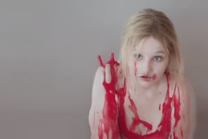 a beautiful woman, upper body portrait, beautiful makeup, perfect hands, perfect nails, completely covered in red ooze, whole body covered in red scarlet red paint, the woman is dripping.