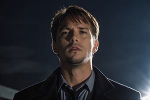 A handsome male detective, scene from detective movie, looking up towards the sky, x files, a powerfull light behind him --style raw ,kyle_hyde