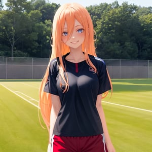 A girl about 18 years old.
Long yellow hair.
Big eyes.
Red face.
Smile on his face.
Wearing athletic short sleeves.
Background sports field.
