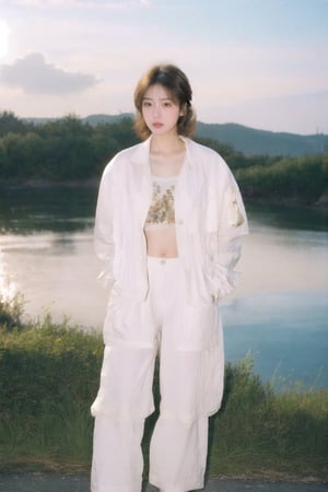 Korean k-pop beauty, 90s Y2K white baggy pants, white windbreaker jacket, white cropped top with design, Japanese classic art Panasonic retro HEADSET, hands in her pockets, mid length layered cut with straight bangs brown hair, stylish makeup, fashion hairstyle, short hairstyles, glows in the golden light of the setting sun, sunset, dreamgirl,1girl,solo, resort, sea side