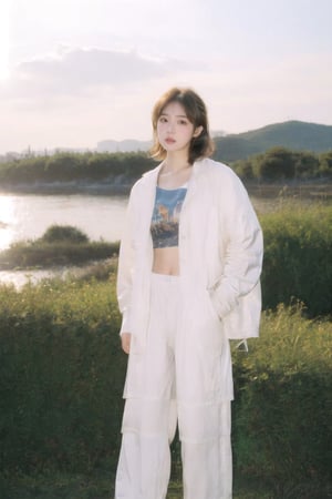 Korean k-pop beauty, 90s Y2K white baggy pants, white windbreaker jacket, white cropped top with design, Japanese classic art Panasonic retro HEADSET, hands in her pockets, mid length layered cut with straight bangs brown hair, stylish makeup, fashion hairstyle, short hairstyles, glows in the golden light of the setting sun, sunset, dreamgirl,1girl,solo, resort, sea side