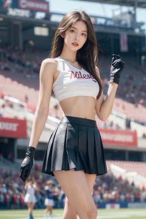 1girl, long hair, breasts, looking at viewer, blue eyes, skirt, brown hair, shirt, gloves, navel, holding, bare shoulders, medium breasts, standing, pleated skirt, parted lips, sleeveless, solo focus, black gloves, midriff, miniskirt, lips, crop top, white skirt, clothes writing, cheerleader, crowd, stadium