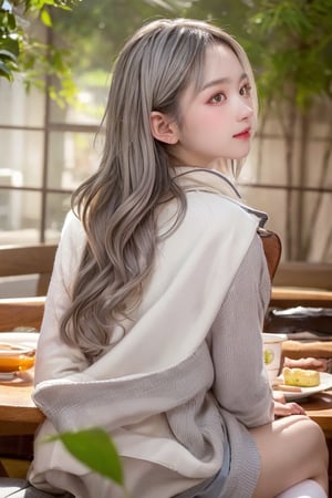 A contemporary color photo of a young Taiwanese girl sitting at an indoor coffee table, with real skin effects, short grey hair, clear facial features, a majestic bust, solo, she is wearing a white cardigan without buttons and high white boots on her feet. Her pose is relaxed, with one leg crossed over the other. The background shows the environment of a modern outdoor coffee shop, including chairs, tables and green plants. The background seems to be a soft shadow under the sunlight, suggesting daytime. On the table there is a cup, saucer and a dessert cup on a wooden tabletop. This composition captures a casual but intimate moment in a trendy urban environment.