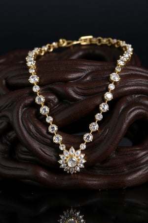 A detailed gold and diamond necklace, designed in the FLUXEvue style. It is resting on a black oak nightstand. Shot with a Hasselblad H6D-100c, low exposure, extreme high contrast, ISO 50, with a 100mm macro lens.