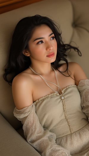 A young woman's serene portrait: soft focus, warm cinematic lighting, and a cozy dress frame her innocent expression. She sits in a gentle pose on a plush sofa, gazing off into the distance with a contemplative look, as if lost in thought. The relaxed posture and subtle smile convey quiet introspection.