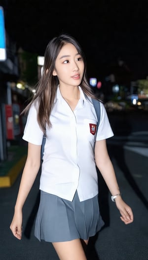 a asian woman in a school uniform. The school uniform is white shirt and grey skirt. her hair is long light brown. She is walking on the street. The background is blurred, dark sky, city scape